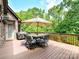 Spacious wooden deck with a grill and an outdoor dining set, perfect for entertaining guests at 633 Elmhurst Dr, Fort Mill, SC 29715