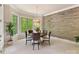 Bright dining area with a modern chandelier, large windows with wood trim, and views of the backyard at 633 Elmhurst Dr, Fort Mill, SC 29715
