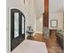 Grand foyer with stone columns, hardwood floors, and decorative front door with sidelights at 633 Elmhurst Dr, Fort Mill, SC 29715