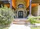 Ornate brick entrance featuring a grand front door and a well-manicured garden at 633 Elmhurst Dr, Fort Mill, SC 29715