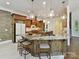 Gourmet kitchen with granite countertops, custom cabinetry, a large island, and stainless steel appliances at 633 Elmhurst Dr, Fort Mill, SC 29715