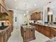 Gourmet kitchen features custom cabinets, granite counters and a large center island with prep sink at 633 Elmhurst Dr, Fort Mill, SC 29715