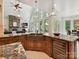 Open kitchen featuring granite counters, a copper sink, a central island with seating, and modern appliances at 633 Elmhurst Dr, Fort Mill, SC 29715