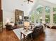 Inviting living room features a stone fireplace, vaulted ceilings, and large windows providing ample natural light at 633 Elmhurst Dr, Fort Mill, SC 29715