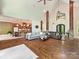 Open-concept living room with hardwood floors, stone columns, and a view of the gourmet kitchen at 633 Elmhurst Dr, Fort Mill, SC 29715