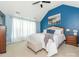 Bright bedroom with vaulted ceiling, light blue walls, and plush bedding, offering a cozy and inviting space at 653 Gable Oaks Nw Ln, Concord, NC 28027