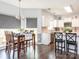 Bright dining area with a dining table, natural light, and an adjacent kitchen area for convenient meal service at 653 Gable Oaks Nw Ln, Concord, NC 28027