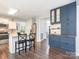 Open-concept kitchen with modern cabinetry, a center island with seating, and stainless steel appliances for gourmet cooking at 653 Gable Oaks Nw Ln, Concord, NC 28027
