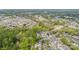 Wide aerial view of a neighborhood surrounded by lush trees and nature at 6707 Dunton St, Huntersville, NC 28078