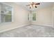 Bedroom with neutral carpet, ceiling fan, and bright windows at 6707 Dunton St, Huntersville, NC 28078
