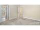 Bedroom with neutral carpet and an open closet at 6707 Dunton St, Huntersville, NC 28078