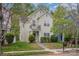 Charming two-story home with a small balcony and well-maintained front yard landscaping at 6707 Dunton St, Huntersville, NC 28078