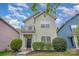Charming two-story home featuring a small balcony, manicured shrubs, and a welcoming front entrance at 6707 Dunton St, Huntersville, NC 28078