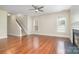 Spacious living room with hardwood floors, fireplace, and abundant natural light at 6707 Dunton St, Huntersville, NC 28078