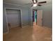 A light-filled bedroom with hardwood floors, closet, and a peek into the en-suite bathroom at 805 Mark Dr, Shelby, NC 28152