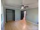 Spacious bedroom with hardwood floors, ample closet space, and modern ceiling fan at 805 Mark Dr, Shelby, NC 28152