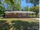 Charming one-story brick home with a well-maintained lawn and covered parking, perfect for easy access at 805 Mark Dr, Shelby, NC 28152
