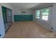Bright living room with hardwood flooring and updated wainscoting, creating a cozy and inviting space at 805 Mark Dr, Shelby, NC 28152
