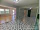 Open floorplan with hardwood floors and striking black and white tile, blending modern design with classic appeal at 805 Mark Dr, Shelby, NC 28152