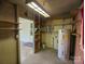 Functional storage room with shelving, utility connections, and access to the outside at 805 Mark Dr, Shelby, NC 28152