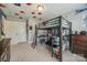 This bedroom features a lofted bed with attached shelving and a desk underneath at 826 Coralbell Way, Fort Mill, SC 29708