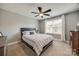This bedroom features plush carpeting and a modern ceiling fan for added comfort at 826 Coralbell Way, Fort Mill, SC 29708