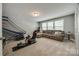 This bonus room includes large windows, a comfy sectional and a gaming chair at 826 Coralbell Way, Fort Mill, SC 29708