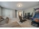 Spacious bonus room features a comfortable couch, gaming chair and basketball hoop at 826 Coralbell Way, Fort Mill, SC 29708