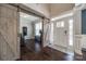 Welcoming foyer showcasing hardwood floors, barn door, and ample natural light at 826 Coralbell Way, Fort Mill, SC 29708