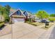 Beautiful home featuring a spacious driveway, well-maintained lawn, and colorful landscaping at 826 Coralbell Way, Fort Mill, SC 29708