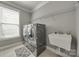 A spacious laundry room with a modern washer and dryer, sink, and ample storage space at 826 Coralbell Way, Fort Mill, SC 29708