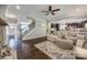 Comfortable living room with hardwood floors, an open concept to the stairs and kitchen at 826 Coralbell Way, Fort Mill, SC 29708
