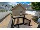 Backyard featuring a brick patio, privacy fence, and detached two car garage at 10102 Tolleson Ave, Charlotte, NC 28277