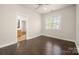 Spacious bedroom features hardwood floors, a large closet, and an en suite bathroom at 10102 Tolleson Ave, Charlotte, NC 28277
