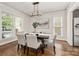 Elegant dining room with stylish light fixture and hardwood floors at 10102 Tolleson Ave, Charlotte, NC 28277