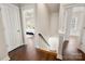 Upstairs hallway showcasing access to bedrooms with bright natural light and hardwood floors at 10102 Tolleson Ave, Charlotte, NC 28277