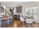 Kitchen with breakfast bar, grey cabinets, stainless steel appliances, and an eat-in area at 10102 Tolleson Ave, Charlotte, NC 28277