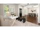 Inviting living room with refinished hardwood floors seamlessly connecting to the dining area at 10102 Tolleson Ave, Charlotte, NC 28277