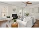 Inviting living room with fireplace, ceiling fan, comfortable seating, and modern decor at 10102 Tolleson Ave, Charlotte, NC 28277