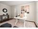 Bright living room with stylish desk, modern decor, and refinished hardwood floors at 10102 Tolleson Ave, Charlotte, NC 28277