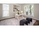 Stylish living room featuring a bright work area and sleek modern decor at 10102 Tolleson Ave, Charlotte, NC 28277