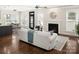 Bright living room with fireplace, plenty of natural light, and hardwood floors at 10102 Tolleson Ave, Charlotte, NC 28277