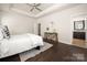 Spacious main bedroom with tray ceiling, hardwood floors, and ensuite bathroom access at 10102 Tolleson Ave, Charlotte, NC 28277