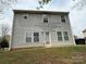 Exterior rear view of the home showcasing light gray siding and a well-maintained lawn at 1110 Valley St, Statesville, NC 28677