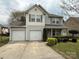 Charming two-story home with a two-car garage, well-maintained lawn, and manicured bushes at 1110 Valley St, Statesville, NC 28677
