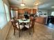 Open kitchen with stainless steel appliances, a central island, and natural lighting at 1110 Valley St, Statesville, NC 28677