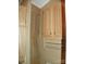 Neutral bathroom with wooden cabinets and decorative curtains for added charm at 124 Hummingbird Cir, New London, NC 28127