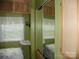 Bedroom featuring mirrored closet with storage, paired with natural light, optimizing functionality at 124 Hummingbird Cir, New London, NC 28127