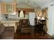 Cozy living space featuring an open floor plan and natural light, perfect for comfortable living at 124 Hummingbird Cir, New London, NC 28127