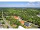 An aerial view of a new housing construction in a tree-lined neighborhood with lake views at 139 Poplar Grove Rd, Mooresville, NC 28117